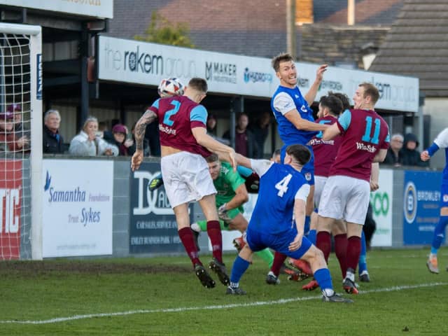 Sam Pashley heads home Emley's goal against Squires Gate in the FA Vase. Picture: Mark Parsons