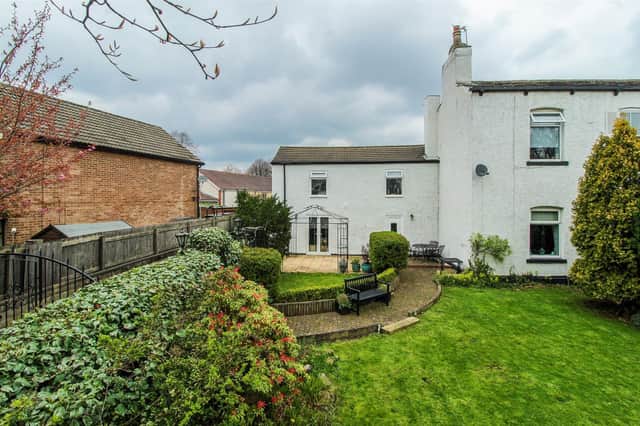 The appealing semi-detached property has lawned gardens with patio areas.