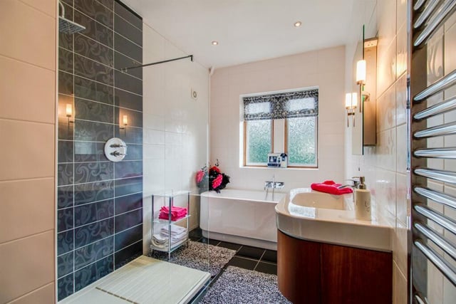 The bathroom is finished to an enviable standard with a modern white and chrome suite comprising double ended bath with shower attachment, a separate walk in shower cubicle with large glazed screen and vanity wash basin with drawers under.