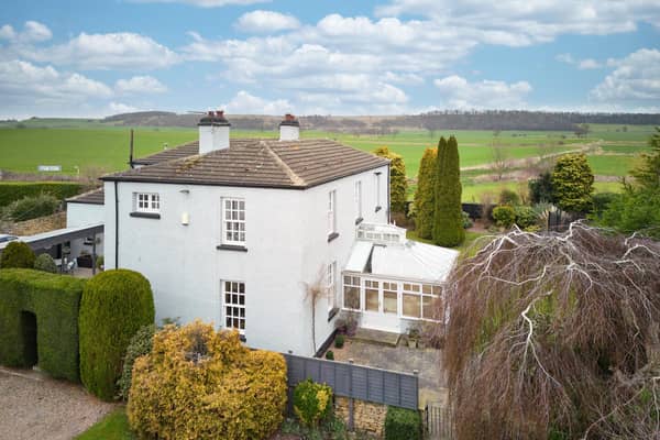 This stunning home has a village location surrounded by countryside.