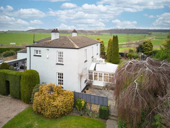 This stunning home has a village location surrounded by countryside.