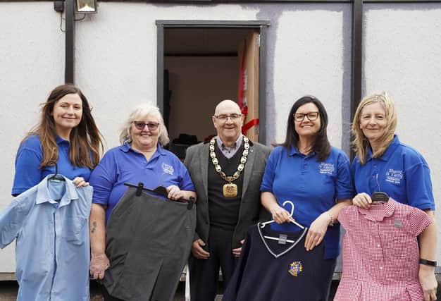 Mayor Coun Jack Hutsby officially launches the new look Featherstone Uniform Bank alongside Hayley Millward, Maureen Tennant-King, Alison Gascoyne and Jane Haigh.