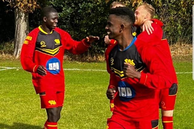 Banta Darbol (right) and Axel Du Ciel Ndwanyi celebrate Wakefield Athletic's late winning strike in their side's 5-4 win over Stanley United.