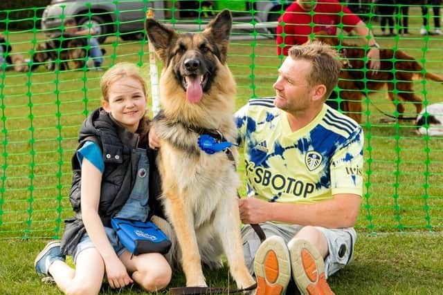 More than 120 people and their pooches turning up to complete a 3km walk around Carr Lodge Park, Horbury.
