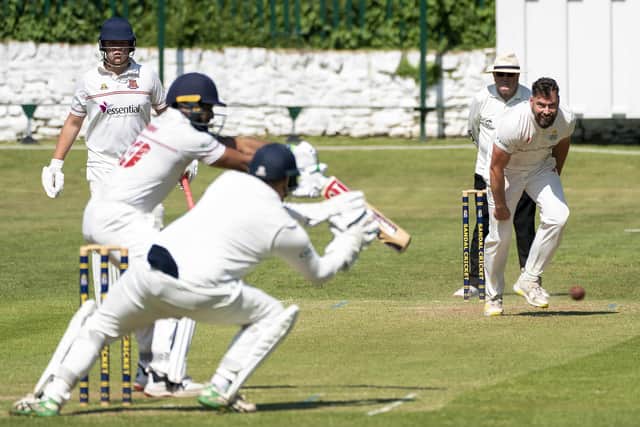 Michael Carroll on his way to taking 2-50 for Sandal against East Bierley. Picture: Scott Merrylees