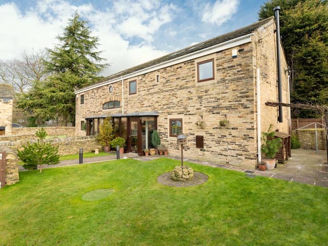 The rustic yet modern barn conversion is for sale within a peaceful hamlet of similar properties.