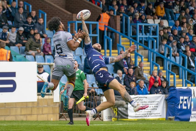Wingers Luke Briscoe and Jonny Campbell compete for a high ball in the Championship play-off semi-final between Featherstone Rovers and Batley Bulldogs. Picture: Dec Hayes