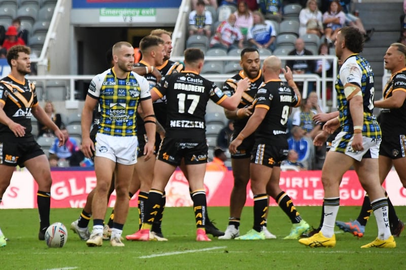 High fives all round as Castleford Tigers players show their delight at winning possession.