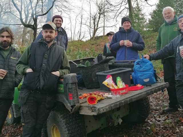 The estates team and volunteers at Yorkshire Sculpture Park take a well earned break as they spend the day clearing diseased rhododendron from the edge of the Upper Lake. Will Grinder (second from left), Derek Trimby (right) and Maurice Morgan (third from right).