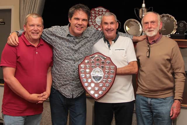 Vulcan Bombers, Division Two Champions 2018-19.  L-R Tim Thrall, Steve Cooke presenting, Ken Taylor and Roy Wood.