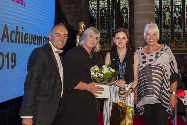Ebony Fisher, second from right, won young achiever in academia.