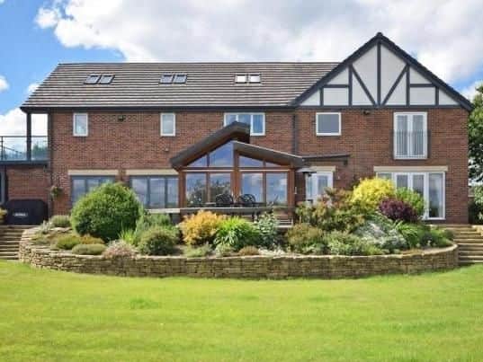 Painthorpe Lane, Crigglestone. Detached home featuring 3/4 acre plot, four bedrooms, a tennis court and a detached double garage.