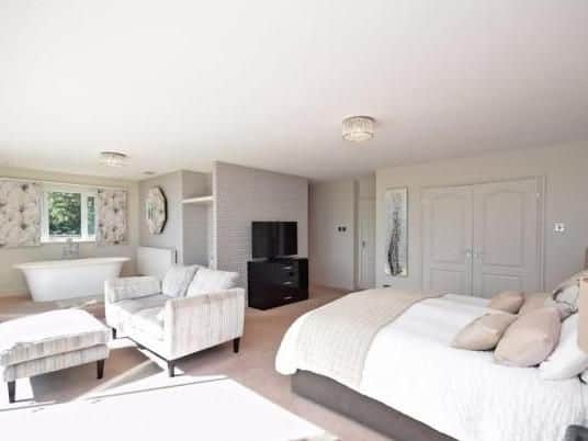 Painthorpe Lane, Crigglestone. Detached home featuring 3/4 acre plot, four bedrooms, a tennis court and a detached double garage.