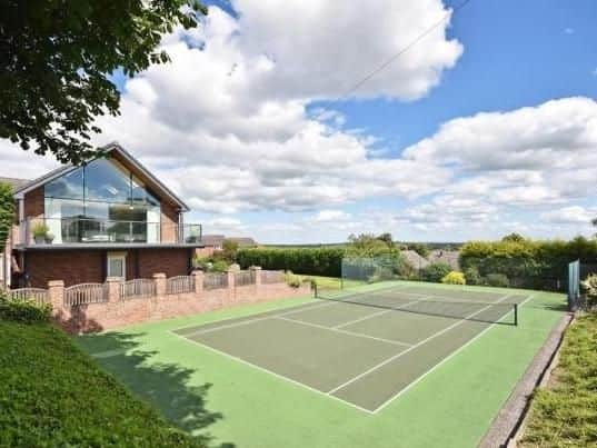Painthorpe Lane, Crigglestone. Detached home featuring 3/4 acre plot, four bedrooms, a tennis court and a detached double garage.