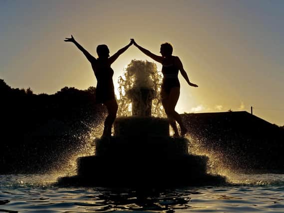 Swimmers Joanne Crowther and Alla Horoshenkova at Ilkley Lido celebrate the summer soltice by having a dip at sunrise. Picture Tony Johnson.