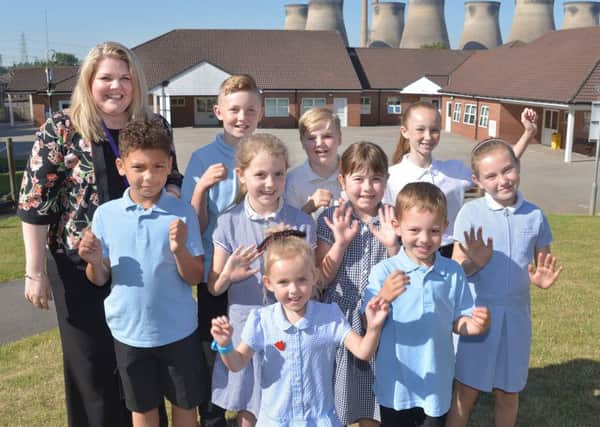 Head Caroline Towler and children from Brotherton and Byram celebrate their rating.