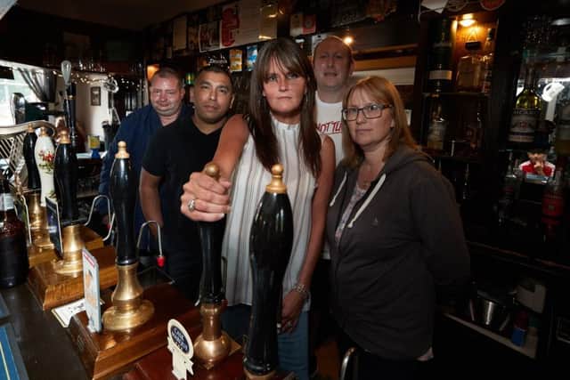 Drinkers at the Bingley Arms pub, at Horbury Bridge, are campaigning to keep it open.