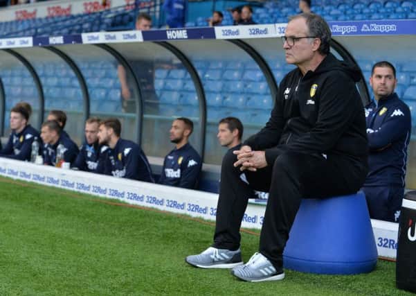 Marcelo Bielsa watches on sat on his upturned bucket as Leeds United take on Bolton Wanderers. Picture: Bruce Rollinson