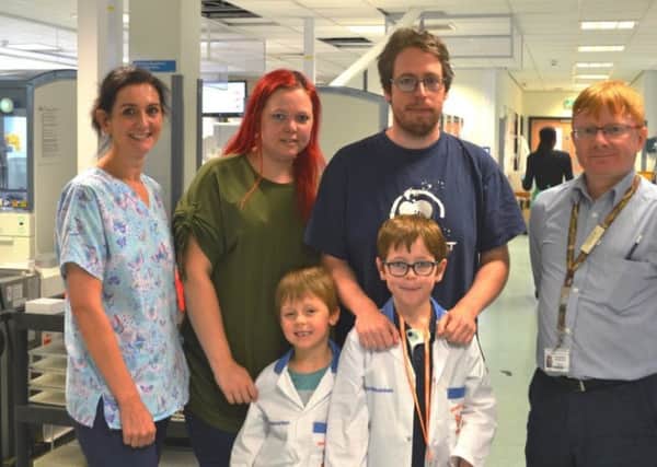 From left are Sarah Seymour, hospital play leader, Suzanne Hullah, Scot Pickard, Dr Iain Woodrow, clinical biochemist with Ben Pickard, aged six,  and Thomas Pickard, nine.