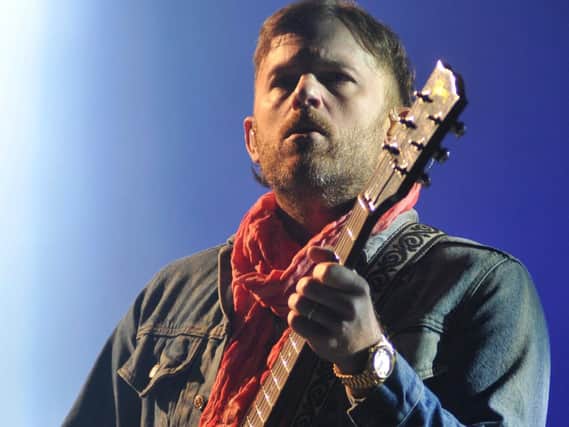 Kings Of Leon's Caleb Followill on stage at the Leeds Festival.