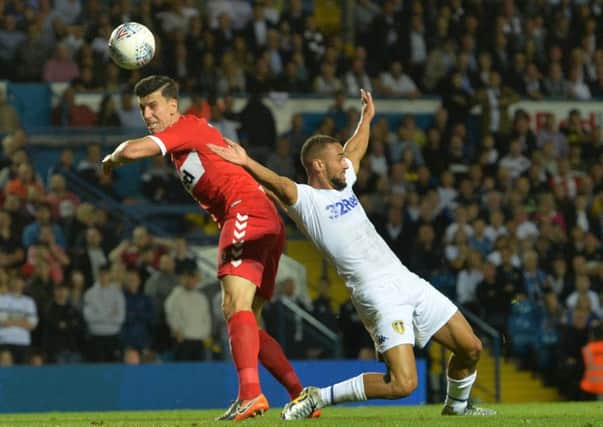 Daniel Ayala clashes with Kemar Roofe in the area, but there was no penalty for Leeds United against Middlesbrough. Picture: Bruce Rollinson