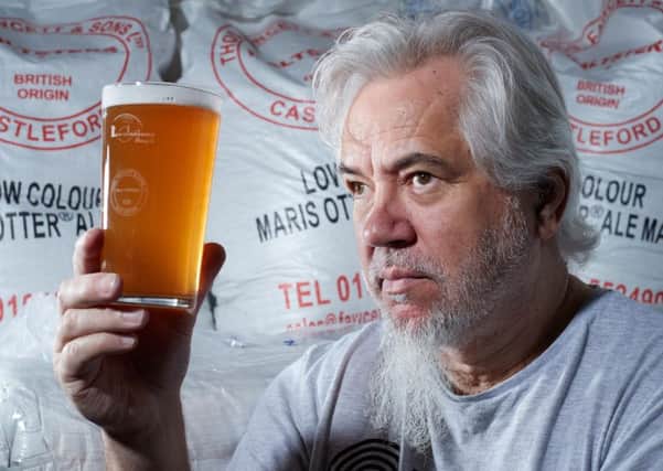 Revolutions founder Mark Seaman checks over his beer.