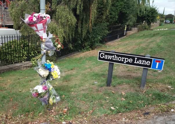 Scene: Flowers and tributes have been left at Batley Road.