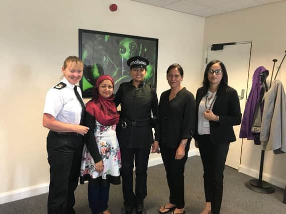Chief Constable Dee Collins, left, with PC Fiz Ahmed, centre, modelling the alternative uniform at a meeting with the Muslim Women's Council.