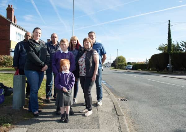 Campaigners in Kirkhamgate want traffic calming measures on Batley Road after a fatal crash involving three vehicles.