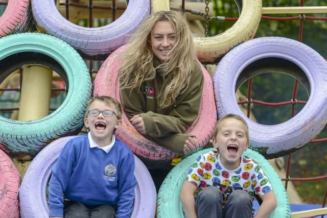The Addys youth worker Tara Watson with Clayton Lockhart and James Cook.