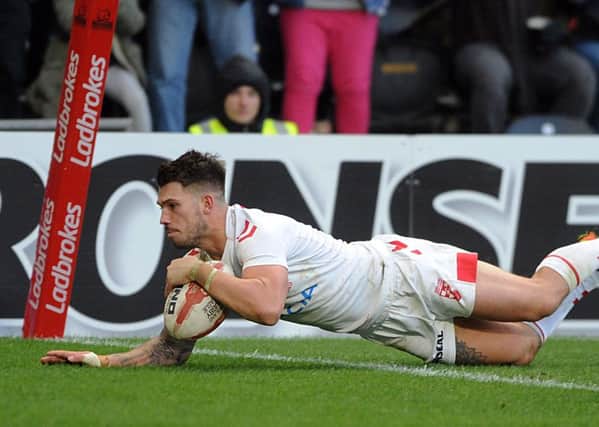 Oliver Gildart goes over for England's winning try.