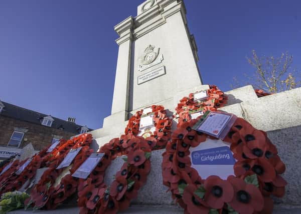 Pontefract Remembrance, Market Square, Pontefract, England - Wreaths on the Pontefract war memorial.