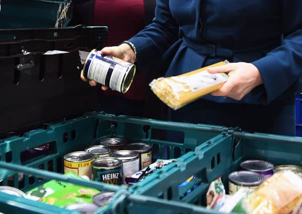 File photo dated 17/01/18 of goods at a food bank. Figures from the Trussell Trust reveal problems with Universal Credit are driving an increase in the number of emergency supplies handed out at food banks. PRESS ASSOCIATION Photo. Issue date: Tuesday November 6, 2018. The charity said that if the five-week minimum wait for a first Universal Credit payment is not reduced, the only way to prevent more people being forced to rely on food banks is to pause all new claims for the benefit. See PA story INDUSTRY FoodBanks. Photo credit should read: Andy Buchanan/PA Wire