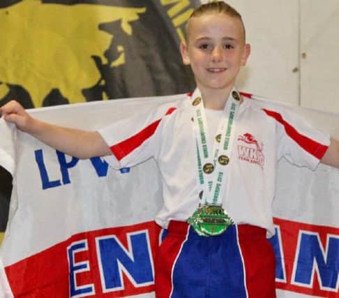 George Emsley shows off the silver medals he won at the World Karate and Kickboxing Championships in Ireland.
