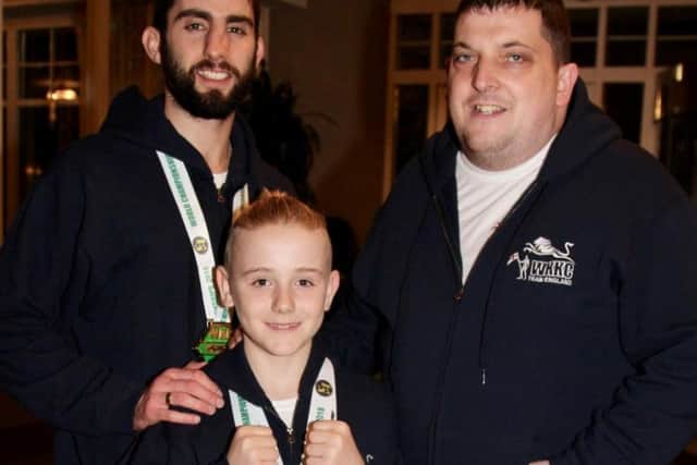 George Emsley with his coach, Hayden Lindley, and his chief instructor, Andy Crittenden.