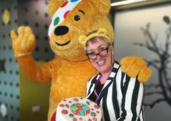 Pontefract's Karen Wright, who shot to fame as a contastant on The Great British Bake Off earlier this year, with Pudsey bear.