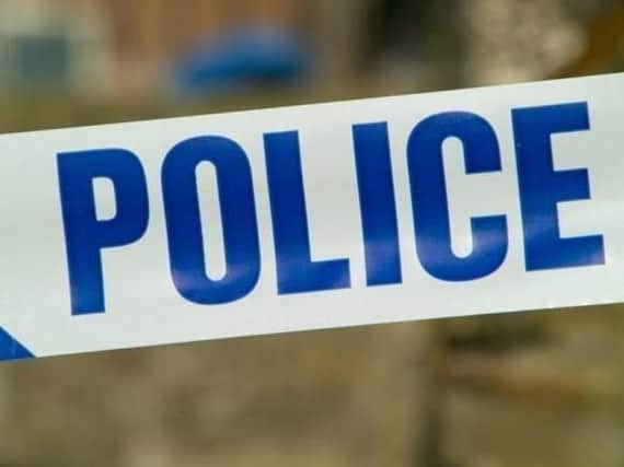 A teenager has been arrested in connection with a violent robbery at a village store.