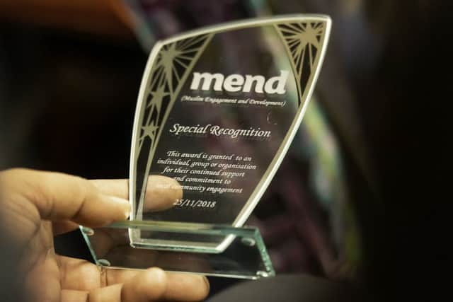 MEND Special Recognition award trophy.