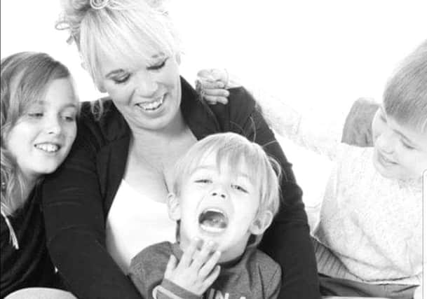 Grateful: Kerry Stevens and her three children.