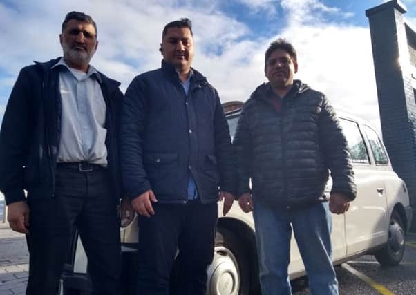 VICTORY: The Wakefield District Private Hire and Hackney Association, led by Wajid Ali (centre) has won their case against Wakefield Council, who now face a potentially massive bill.