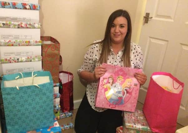 Success: Lucy Woodcock with some of the 165 gift bags that were donated to her appeal