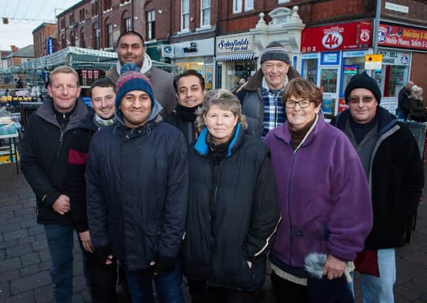 Traders have won a battle to have the stalls back to how they were after the council changed them round.