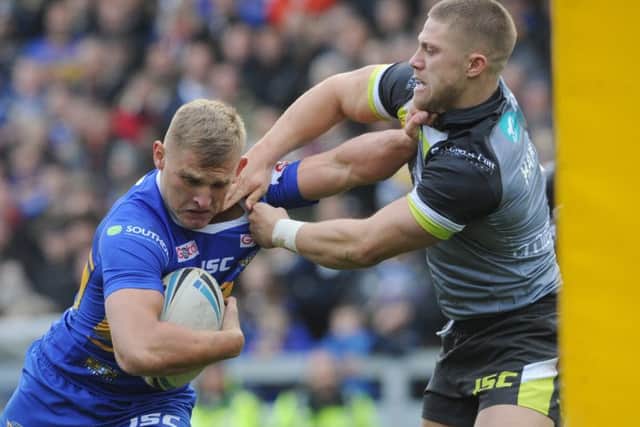 Ryan Hampshire, right, getting to grips with Brad Dwyer during Wakefield's festive challenge at Leeds Rhinos on Boxing Day. PIC: Steve Riding/Varley's Picture Agency