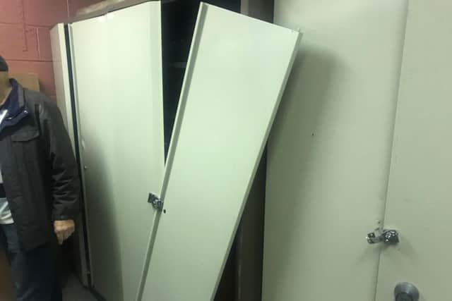 Secure cabinets were forced open and items stolen from inside.