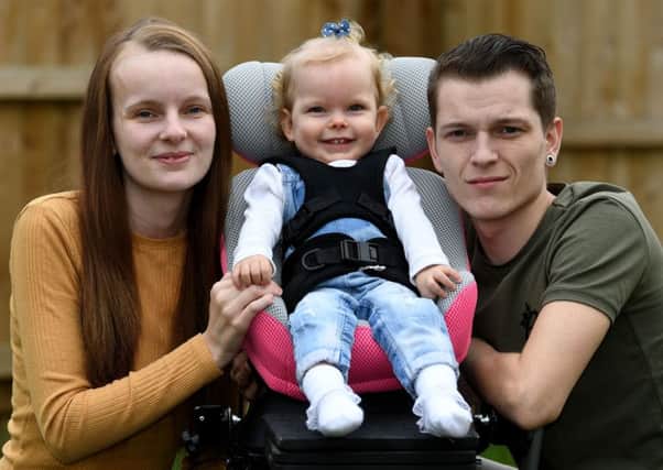 Imogen Holmes pictured in March 2018  with her parents Briony Winstanley and  Stephen Holmes.