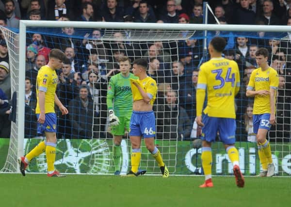 Leeds United players look dejected after Leif Davis concedes a penalty at QPR. Picture: Tony Johnson