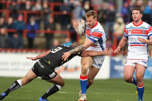 Tom Johnstone scored a hat-trick as Wakefield secured victory over Hull FC. PIC: John Clifton.