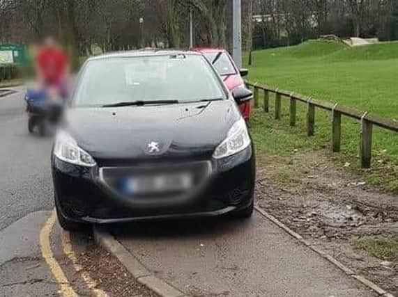 Cars have been left on double yellow lines and are blocking pavements at Thornes Park.