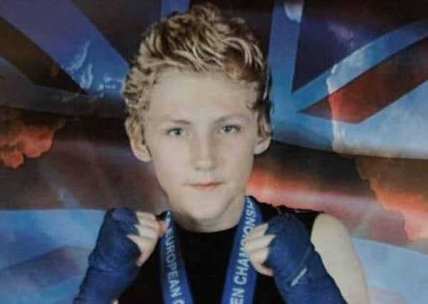 Scott Marsden with his gold medal during the WTKA, European Open Championships 2015. See rossparry story RPYKICK: A teenager who was taken ill during a top national kickboxing match has died. Scott Marsden, 14, known as Scotty, was competing for an English title at Leeds Martial Arts college, West Yorks., on Sunday when he was rushed to hospital. The title fight had been close with just one point separating two of the country's best young fighters and there was nothing to suggest the contest needed to be stopped up to that point.
Writer: 	SWNS - Leeds +44 (0)1179066550
