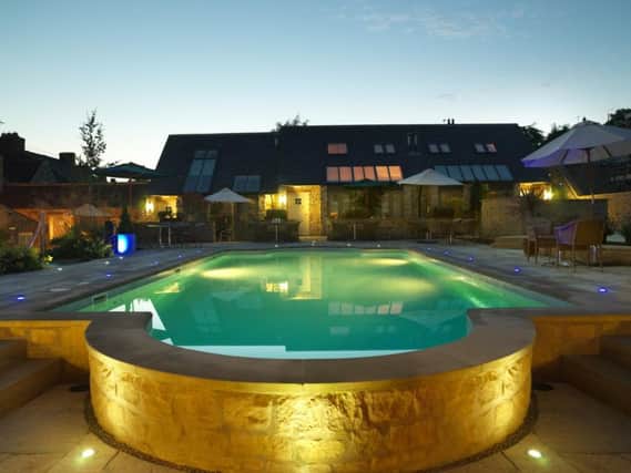 The outdoor pool lit up at night